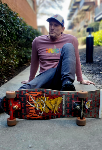 Dustin Hoxworth with skateboard